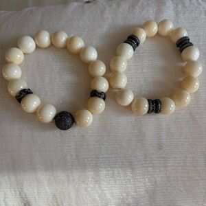 Elegant ivory stretch bracelets with brown diamonds.